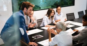 Creative group of business people working on business project in office
